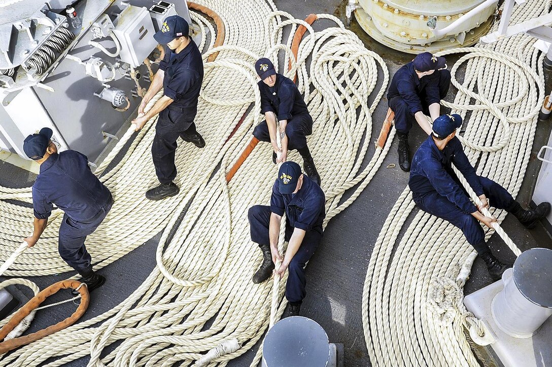 Sailors aboard the USS Iwo Jima heave mooring lines during a sea-and-anchor detail as the ship pulls into Mayport, Fla., Oct. 28, 2016. The amphibious assault ship returned to its homeport after completing humanitarian aid and disaster relief efforts in Haiti. Navy photo by Petty Officer 3rd Class Gary J. Ward