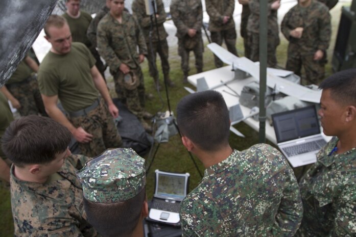 Philippine Marines learn about the RQ-11 Raven unmanned aerial system from U.S. Marines with the 31st Marine Expeditionary Unit during training at Colonel Ernesto Ravina Air Base, Philippines, during Philippine Amphibious Landing Exercise 33 (PHIBLEX), Oct. 8, 2016. The Philippine Marines partner with their U.S. counterparts routinely to share tactics, techniques and procedures to further the U.S-Philippine bilateral partnership. PHIBLEX is an annual U.S.-Philippine military bilateral exercise combining amphibious capabilities and live-fire training with humanitarian civic assistance efforts to strengthen interoperability and working relationships. (U.S. Marine Corps Photo by Staff Sgt. T.T. Parish/Released) 