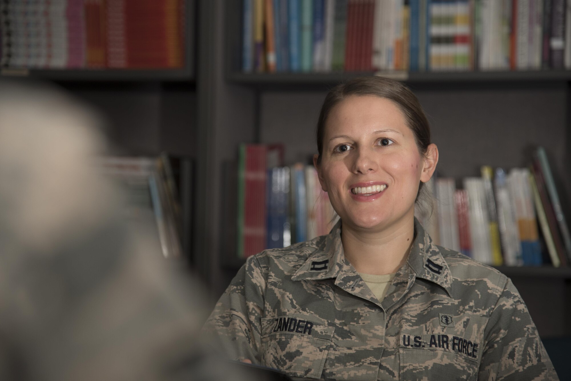 U.S. Air Force Capt. Mary Zander, a psychologist with the 35th MEdical Operations Squadron, remembers her siblings in the military as she speaks to a patient at Misawa Air Base, Japan, Nov. 3, 2016. Zander said whenever she thinks about experiences her sibling may go through, it drives her to be the best mental health provider she can be. (U.S. Air Force photo illustration by Airman 1st Class Sadie Colbert)