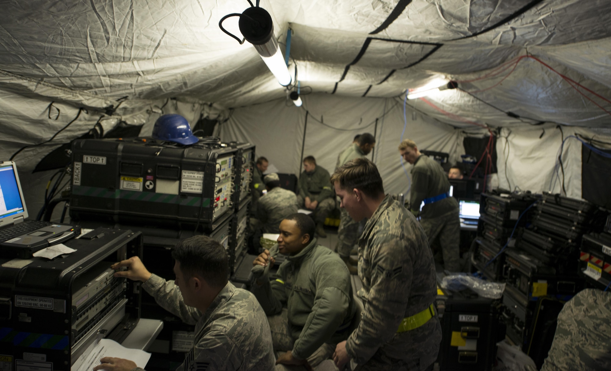Airmen assigned to the 1st Combat Communications Squadron set up communications during exercise Healthy Thunder at Ramstein Air Base, Germany, Oct. 27, 2016. The squadron was broken into several teams during the exercise, each one playing its own role. The purpose of Healthy Thunder was to prepare the Airmen for a deployed situation. (U.S. Air Force photo by Senior Airman Tryphena Mayhugh)