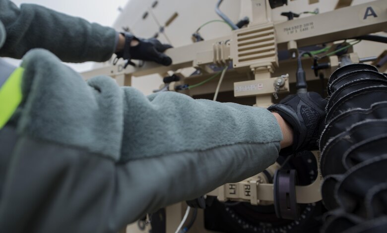 Staff Sgt. Al Lotito, 1st Combat Communications Squadron radio frequency transmission systems technician, works on setting up a satellite dish during the exercise Healthy Thunder at Ramstein Air Base, Germany, Oct. 27, 2016. Team A1, the largest section in the exercise, was in charge of setting up initial communication and providing power for the other teams. (U.S. Air Force photo by Senior Airman Tryphena Mayhugh)