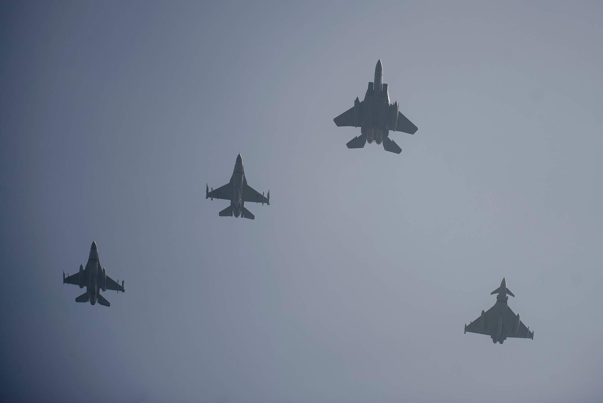 A U.S. Air Force F-16 Fighting Falcon, a Republic of Korea air force F-16 and F-15K Slam Eagle, and a United Kingdom Royal Air Force Typhoon FGR4 fly in formation during Invincible Shield on Osan Air Base, Republic of Korea, Nov. 8, 2016. The intent of Invincible Shield is to bolster the interoperability between the RoK, the U.S. and United Kingdom while improving combat capability in the Pacific region. (U.S. Air Force photo by Staff Sgt. Jonathan Steffen) 