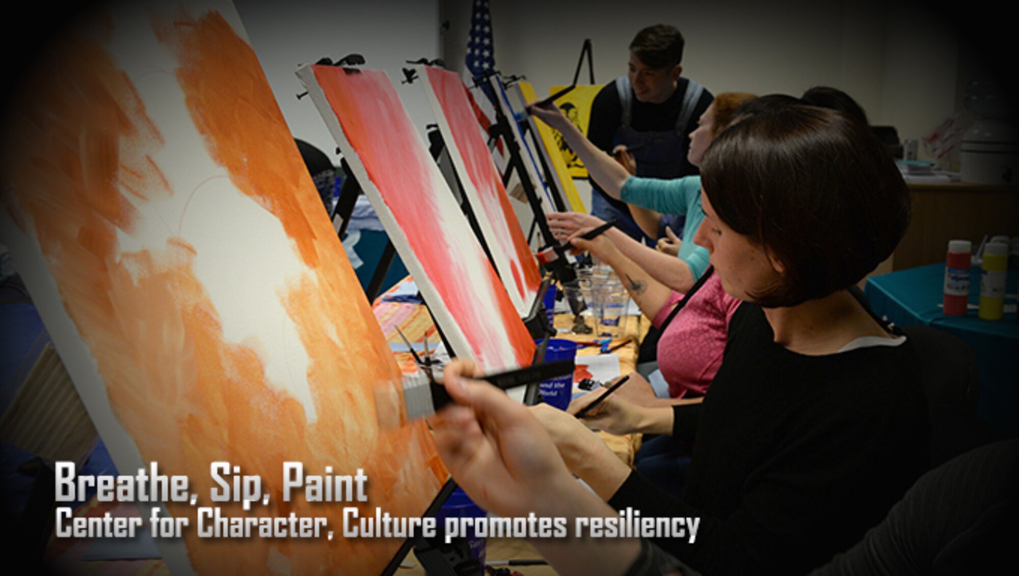 Attendees of the “Breathe, Sip, Paint’ event focus on their paintings Nov. 4, 2016, on RAF Mildenhall. The Center for Character and Culture organized the event to promote a stress-free creative environment and teach holistic means of resiliency. (U.S. Air Force photo by Senior Airman Justine Rho)