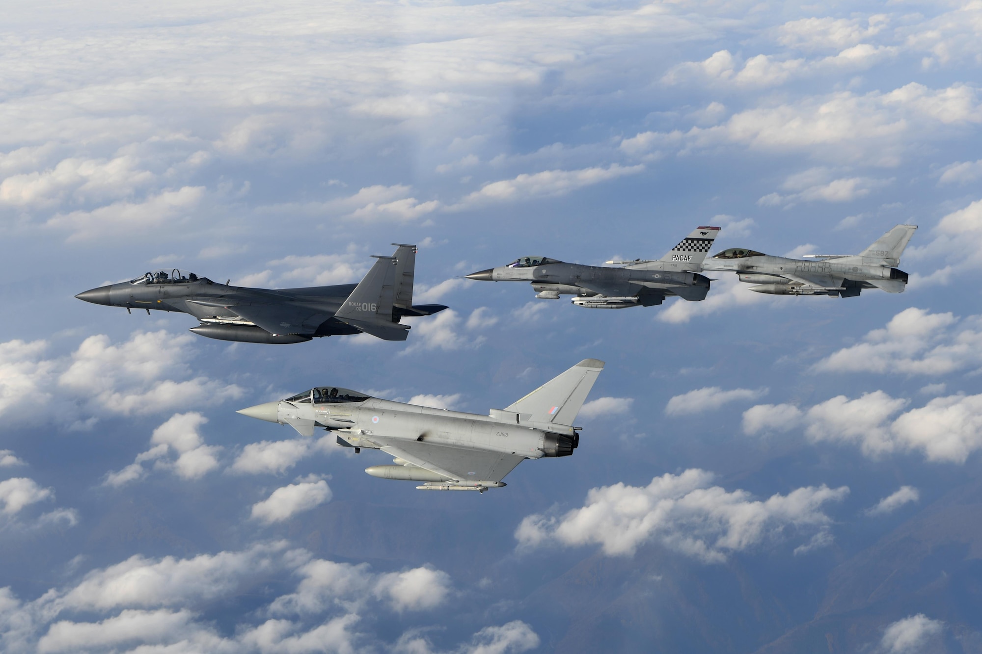 A Royal Air Force Eurofighter Typhoon FRG4, U.S. Air Force F-16 Fighting Falcon, and a Republic of Korea air force F-16 and F-15K Slam Eagle fly in formation during Invincible Shield on Osan Air Base, Republic of Korea, Nov. 7, 2016. The intent of Invincible Shield is to bolster the interoperability between the RoK, the U.S. and United Kingdom while improving combat capability in the Pacific region. (DoD photo by Chief Master Sgt. Kim, Kyeong Ryul, Republic of Korea air force)