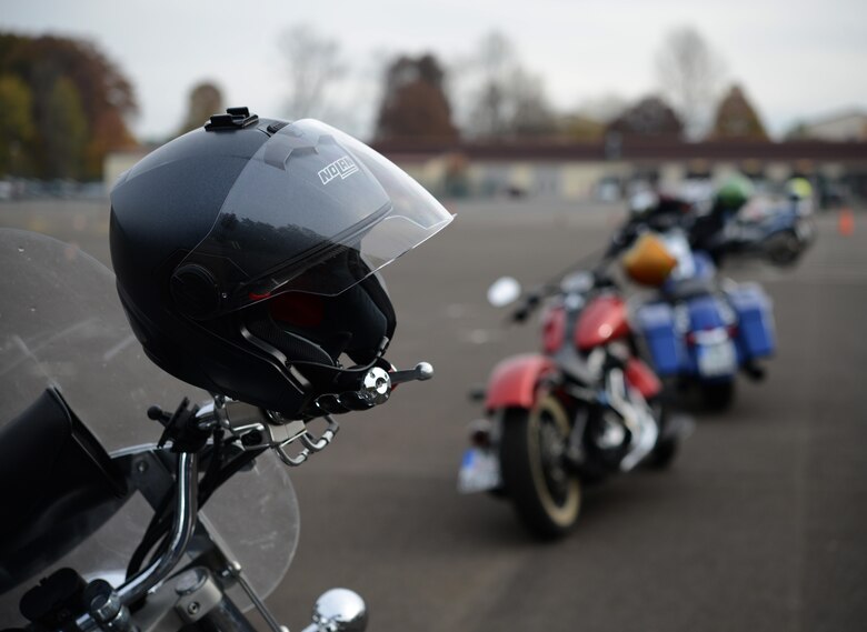 A helmet is displayed on the handlebar of a motorcycle during a motorcycle safety rodeo at Kapaun Air Station, Germany, Nov. 4, 2016. The 86th Airlift Wing safety office arranged for German police and Kaiserslautern Military Community RiderCoaches to come and teach KMC motorcyclists how to be safer and better riders. (U.S. Air Force photo by Airman 1st Class Joshua Magbanua)