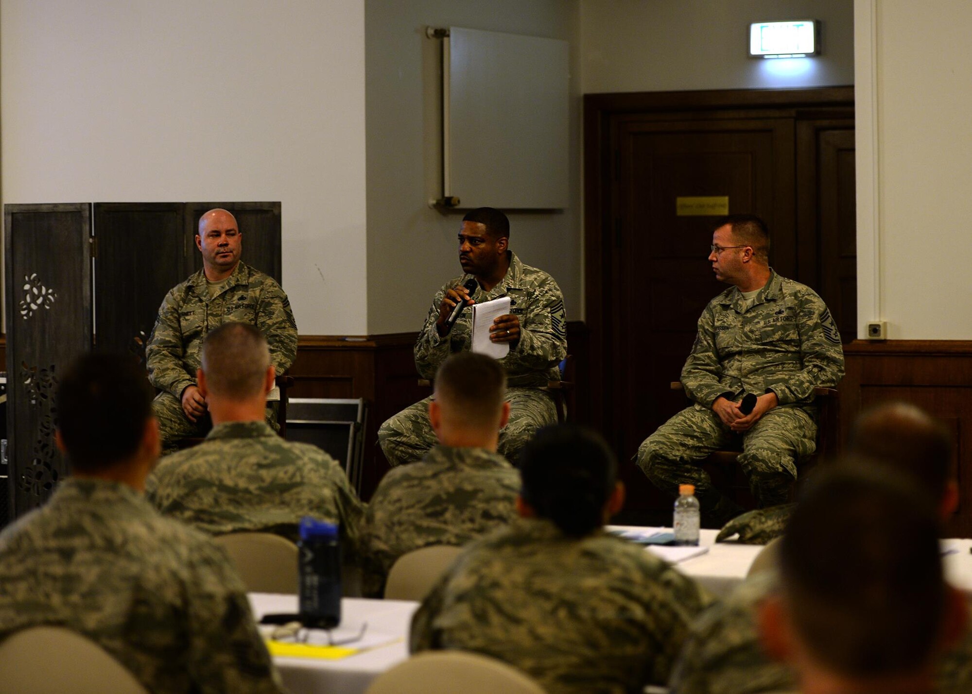 From left to right, Chief Master Sgt. Aaron Bennett, 86th Airlift Wing command chief, Chief Master Sgt. Phillip Easton, 3rd Air Force command chief, and Chief Master Sgt. Edwin Ludwigson, 52nd Fighter Wing command chief, respond to attendees of the Chiefs’ Business Symposium at Ramstein Air Base, Germany, Nov. 2, 2016. The command chief panel allowed attendees to receive mentorship and feedback from chiefs in command positions. (U.S. Air Force photo by Senior Airman Jimmie D. Pike)