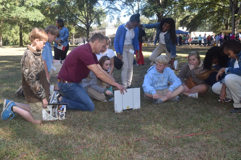 ITL’s Bryan Register explains TeleEngineering and deployable satellite communications to an interested group of Academy of Innovation students.