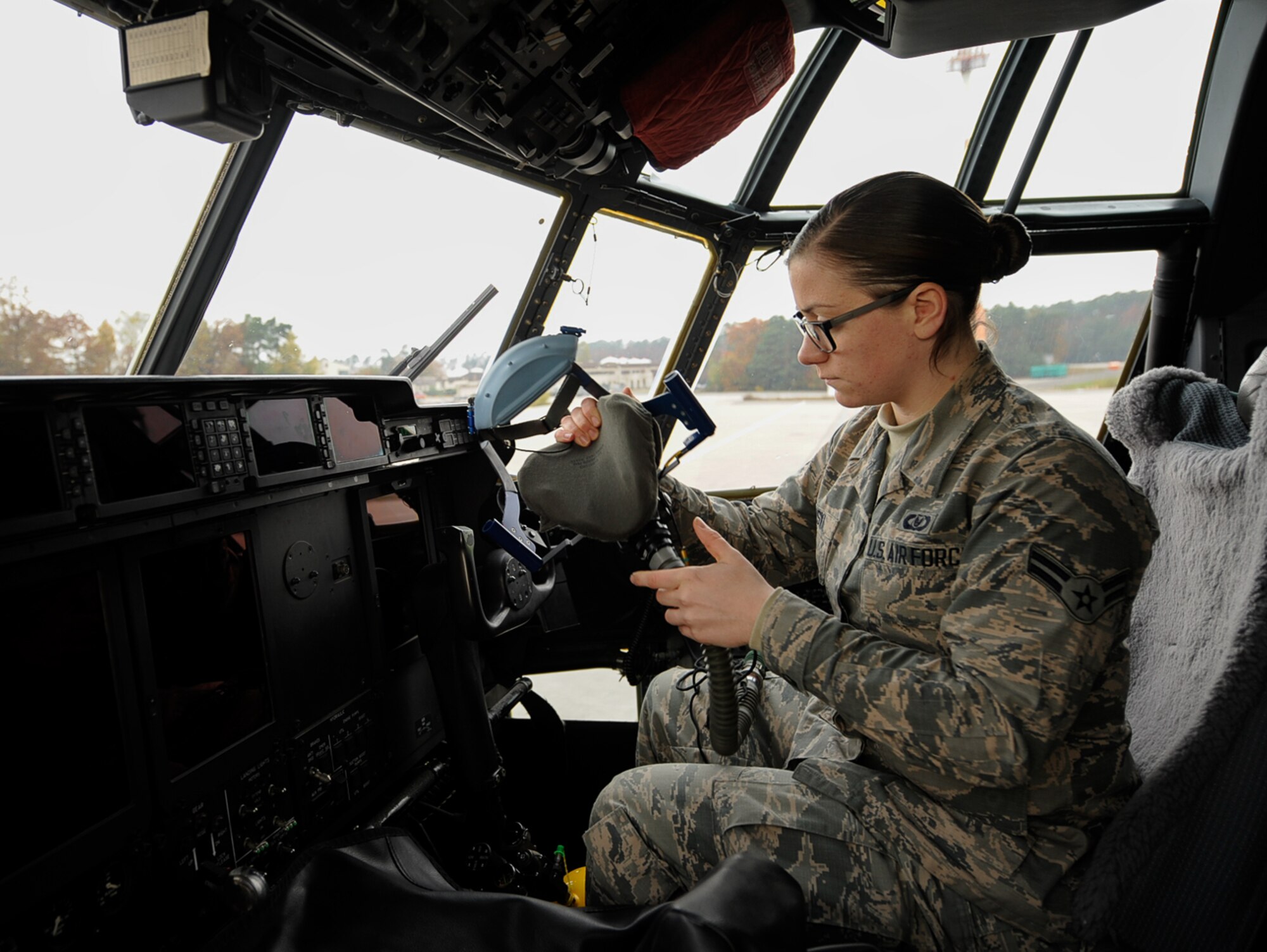 Airman 1st Class Adriya Osinski, 86th Operations Support Squadron aircrew flight equipment apprentice, adjusts an oxygen mask inside of a 37th Airlift Squadron C-130 J Super Hercules aircraft at Ramstein Air Base, Germany, Nov. 4, 2016. As an aircrew flight equipment technician, Osinski prepares equipment such as oxygen and survival vests, which include medical supplies, ways to purify water, and other basic survival items. (U.S. Air Force photo by Airman 1st Class Savannah L. Waters)

