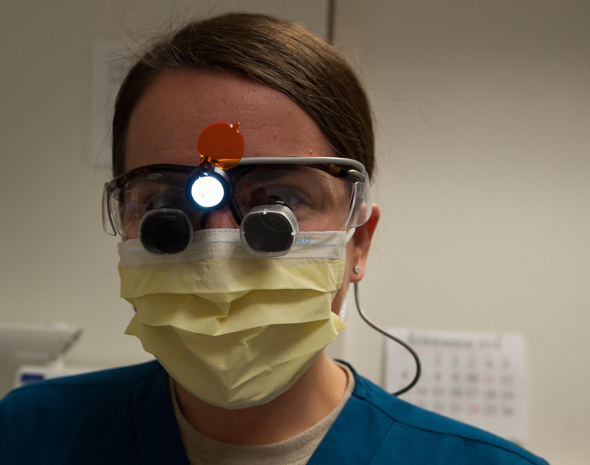 Capt. Heather Rybar, 86th Dental Squadron general dentist, poses for a portrait before attending to her patient during her squadron’s “Little Teeth, Big Smile” event at Ramstein Air Base, Germany, Nov. 5, 2016. The event was a children-focused initiative to encourage parents to bring their children ages up to 10 years old to get their teeth checked or cleaned. According to the Center for Disease and Control, tooth decay is one of the most common chronic conditions of childhood in the United States. Untreated cavities can cause pain and infections that may lead to problems with eating, speaking, playing, and learning. (U.S. Air Force photo by Airman 1st Class Lane T. Plummer)