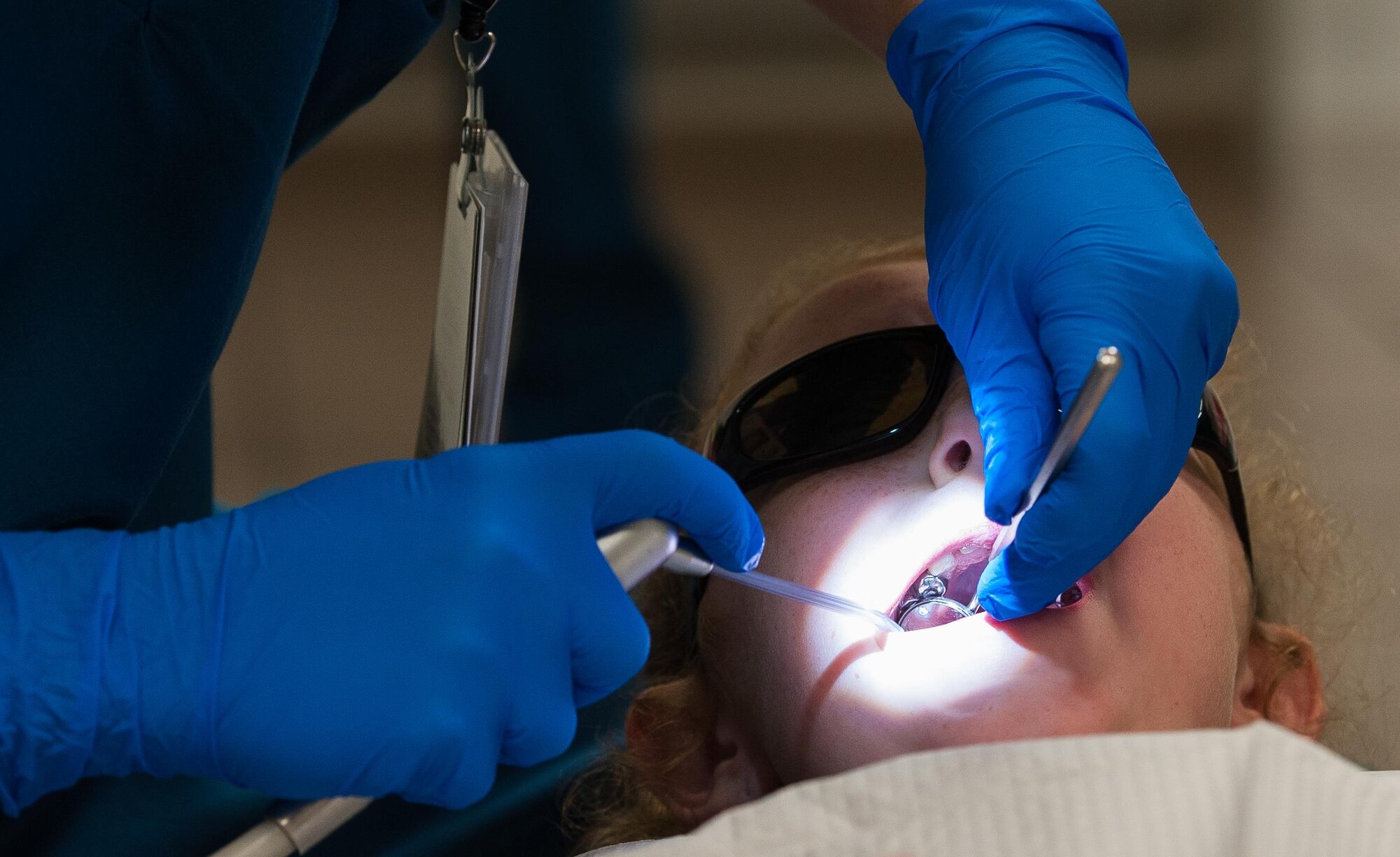 Emma LeNeave, receives a teeth cleaning during the 86th Dental Squadron’s “Little Teeth, Big Smile” event at Ramstein Air Base, Germany, Nov. 5, 2016. Children up to 10 years old were encouraged to attend the event with their parents. According to the Center for Disease and Control, tooth decay is one of the most common chronic conditions of childhood in the United States. Untreated cavities can cause pain and infections that may lead to problems with eating, speaking, playing, and learning. (U.S. Air Force photo by Airman 1st Class Lane T. Plummer)