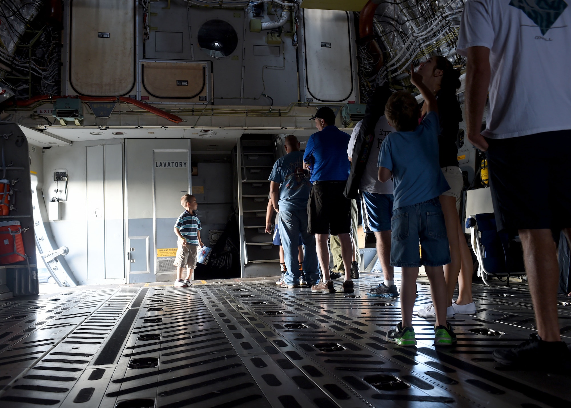 Air show attendees, wait in line to see the flight deck of a U.S. Air Force C-17 Globemaster III cargo aircraft, assigned to the 97th Air Mobility Wing, during the 2016 Stuart Air Show, Nov. 5, 2016 at Stuart, Florida. The C-17 was set up as a static display during the air show to help educate attendees about its capabilities and the 97th AMW training mission. (U.S. Air Force photo by Senior Airman Franklin R. Ramos/Released)