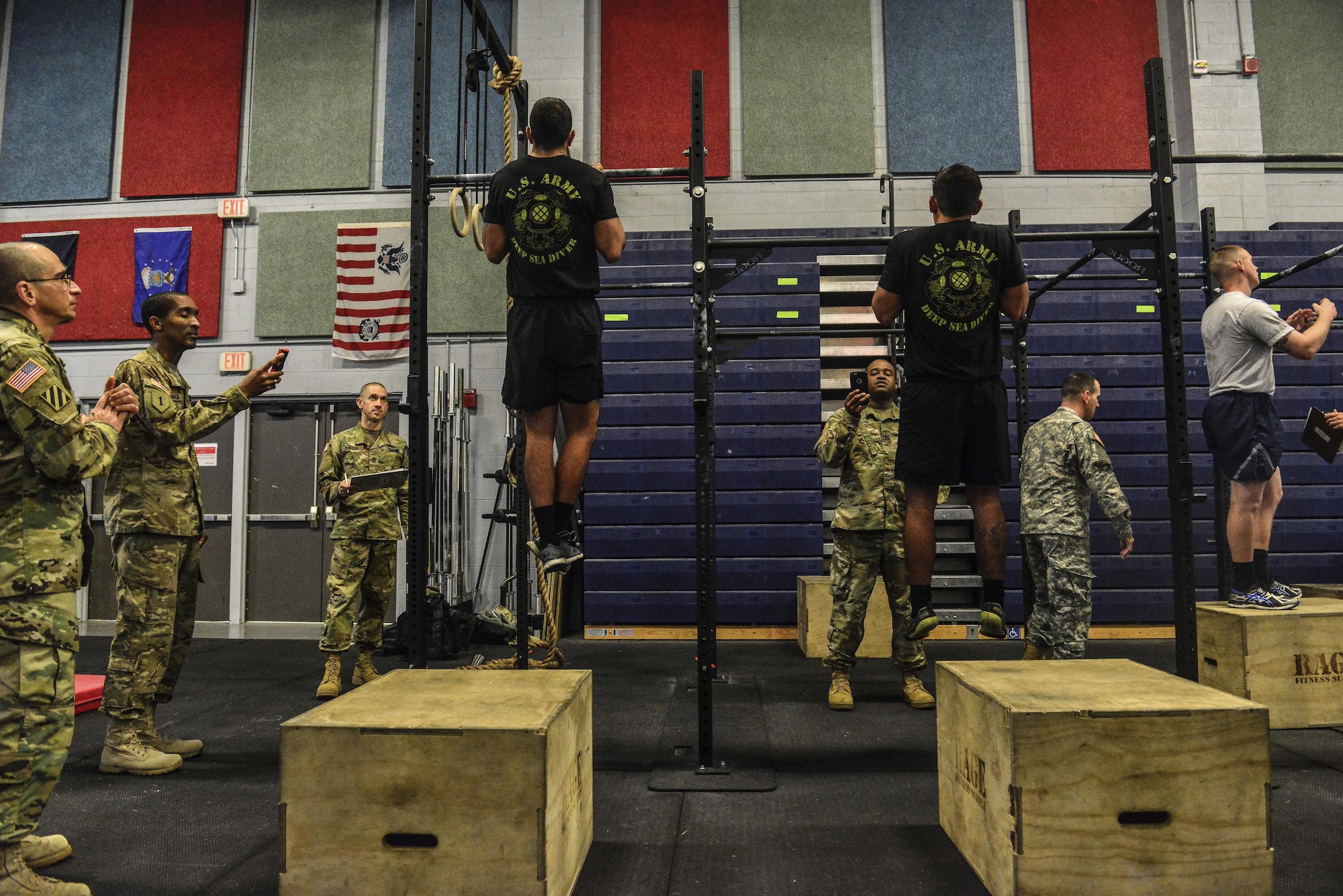 German Armed Forces Badge for military Proficiency proctors evaluate U.S. Air Force Airmen, U.S. Army Soldiers and U.S. Navy Sailors performing a flexed-arm hang during the GAFPB at Joint Base Langley-Eustis, Va., Nov. 1, 2016.  The GAFPB flexed-arm hang is just one of three events that make up the basic fitness test; a five second hold is the minimum requirement to pass.  (U.S. Air Force photo/Tech Sgt. Daylena S. Ricks)