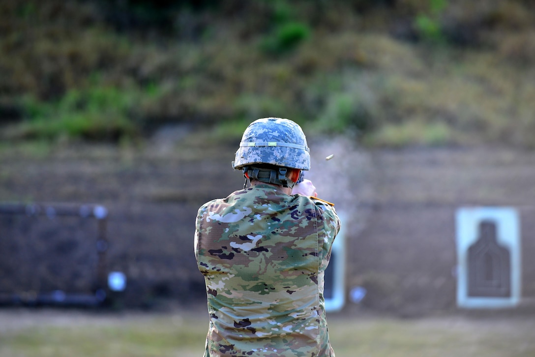 An U.S. Army Soldier fires a 9 mm Beretta automatic pistol in the standing unsupported position during the German Armed Forces Badge for military Proficiency event at Joint Base Langley-Eustis, Va., Nov. 4, 2016. The pistol exercise is one of six GAFPB events, members fire two bullets performing three different shooting positions, aiming to hit the target. (U.S. Air Force photo/Tech Sgt. Daylena S. Ricks)