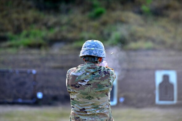 A Soldier fires a 9 mm Beretta automatic pistol in the standing unsupported position during the German Armed Forces Badge for military proficiency event at Joint Base Langley-Eustis, Va., Nov. 4, 2016. The pistol exercise is one of six GAFPB events; members fire two bullets performing three different shooting positions, aiming to hit the target. (U.S. Air Force photo/Tech Sgt. Daylena S. Ricks)