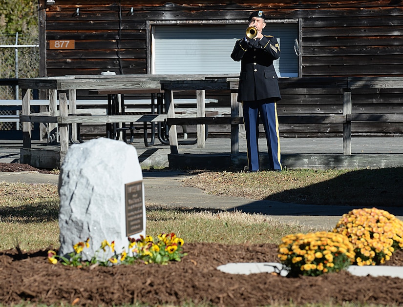 An U.S. Army Soldier plays Taps to honor William J. Franssen, Sr. during an unveiling ceremony at Joint Base Langley-Eustis, Va., Nov. 8, 2016. The Fort Eustis mini park was named to recognize Franssen’s 40 years of service to Morale, Welfare and Recreation programs. (U.S. Air Force photo by Staff Sgt. Teresa J. Cleveland)