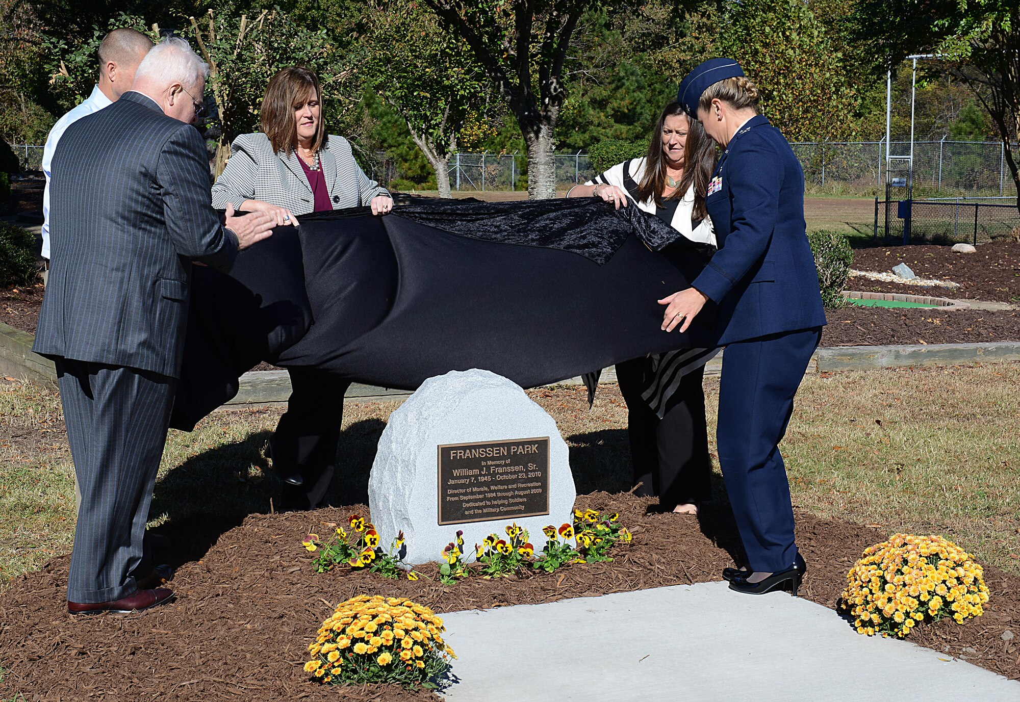 Retired U.S. Army Maj. Gen. David Whaley, Eustis Civil Leaders Association co-chair, William J. Franssen Sr.’s three children and U.S. Air Force Col. Caroline Miller, 633rd Air Base Wing commander, unveil a memorial for Franssen during a ceremony at Joint Base Langley-Eustis, Va., Nov. 8, 2016. The ceremony included guest speakers who worked with Franssen on Morale, Welfare and Recreation programs. (U.S. Air Force photo by Staff Sgt. Teresa J. Cleveland)