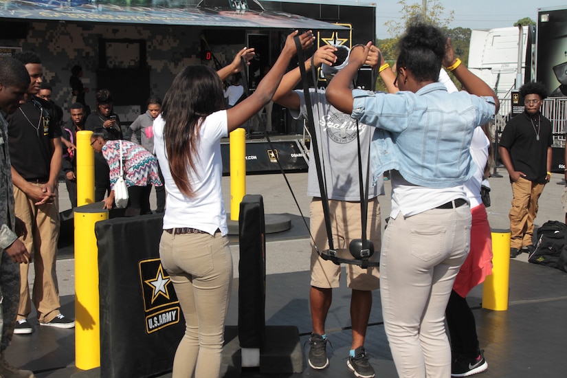 Soldiers of the 318th Chemical Company (CM CO) out of Birmingham, Ala., supported the Historically Black Colleges and Universities (HBCU) Magic City football classic event, Oct. 25-29, 2016, in order to enhance recruiting efforts and to promote awareness of the benefits of Army Reserve service in the HBCU community.
Participation in the MCC provided the Army with school visits and utilized the Go Army Experience Tour assets in order to employ Soldiers to engage and connect with prospects during activations. The Army stage (fitness trailer) was used for participants to compete in a timed, three-tiered challenge: TRX Machine, Vision Coach, and Push-Up/Sit-Up Mat. These activities provided the opportunity for recruiters to interact, encourage or participate with prospects and influencers. It also allowed recruiters to gauge prospects fitness levels.