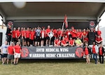 The 959th Medical Group, joined by Maj. Gen. Bart O. Iddins, 59th Medical Wing commander, pose with the commander’s sword and shield trophy at the closing ceremony of the Warrior Medic Challenge, Joint Base San Antonio-Lackland, Nov. 4, 2016. The event pits active-duty and civilian Airmen from the wing’s seven groups against each other in friendly rivalry. (U.S. Air Force photo/Staff Sgt. Kevin Iinuma)