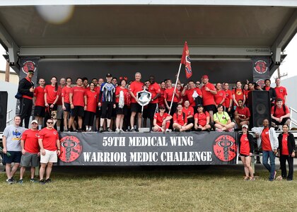 The 959th Medical Group, joined by Maj. Gen. Bart O. Iddins, 59th Medical Wing commander, pose with the commander’s sword and shield trophy at the closing ceremony of the Warrior Medic Challenge, Joint Base San Antonio-Lackland, Nov. 4, 2016. The event pits active-duty and civilian Airmen from the wing’s seven groups against each other in friendly rivalry. (U.S. Air Force photo/Staff Sgt. Kevin Iinuma)