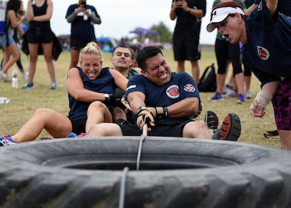 The 59th Medical Operations Group team pulls a 150-pound tire during the ‘Latimus Maximus’ competition at the 2016 Warrior Medic Challenge on Joint Base San Antonio-Lackland, Texas, Nov. 4. During the competition, groups competed to pull their tire across the field of battle the most number of times within five minutes.(U.S. Air Force photo/Staff Sgt. Kevin Iinuma)