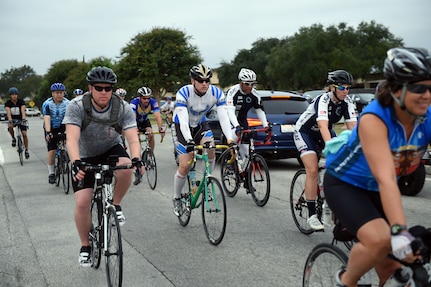 Cyclists start their 59-mile cycle ride at the beginning of the 59th Medical Wing Warrior Medic Challenge on Joint Base San Antonio-Lackland, Texas, Nov. 4, 2016. The event brought the 59th Medical Wing together for a day of friendly, spirited competition designed to build camaraderie amongst members of the wing. (U.S. Air Force photo/Staff Sgt. Jason Huddleston)