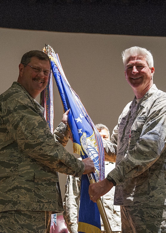 315th Airlift Wing Commander, Col. Gregory Gilmour takes the guideon from departing 315th Maintenance Group Commander, Col. Richard Gay.  Nov. 6.  Members of the 315th Maintenance Group welcomed the new commander to their unit during a change of command ceremony at Joint Base Charleston, South Carolina. Col. Richard Gay relinquished his command of seven years to Col. Sharon Johnson as Gay prepares for his retirement later in the year. (U.S. Air Force Photo by Senior Airman Jonathan Lane)
