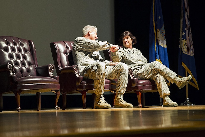 Departing 315th Maintenance Group Commander, Col. Richard Gay.  congratulates new 315th MXG Commander, Col. Sharon Johnson during a change of command ceremony Nov. 6.  Members of the 315th Maintenance Group welcomed the new commander to their unit during a change of command ceremony at Joint Base Charleston, South Carolina. Gay relinquished his command of seven years to Johnson as Gay prepares for his retirement later in the year. (U.S. Air Force Photo by Senior Airman Jonathan Lane)
