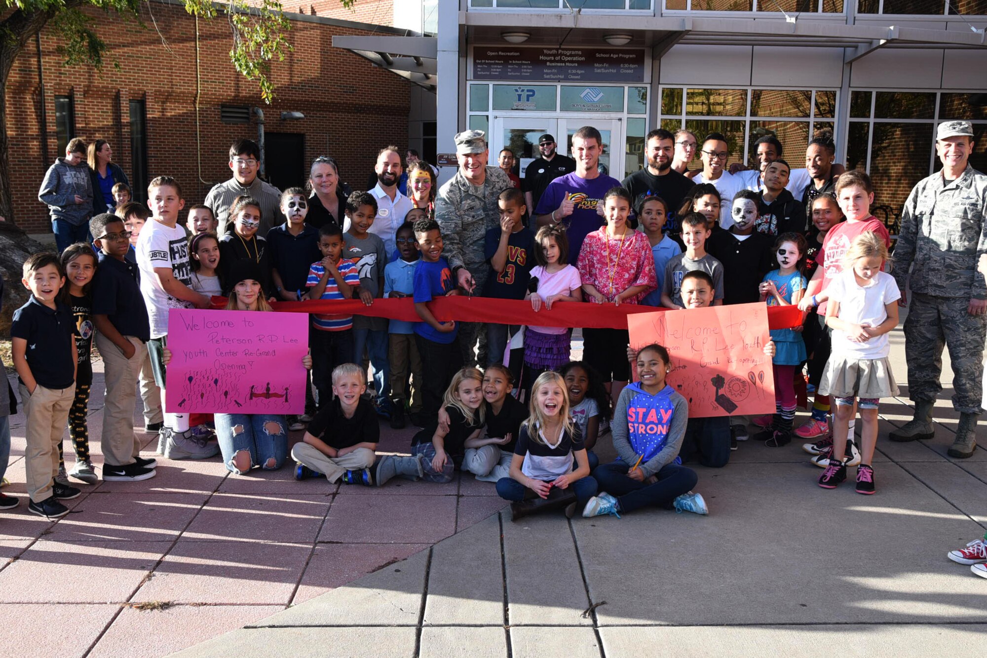 PETERSON AIR FORCE BASE, Colo. – Col. Eric Dorminey, 21st Space Wing vice commander, cuts the ribbon during ceremony for the grand re-opening of the R.P. Lee Youth Center at Peterson Air Force Base, Colo., Nov. 4, 2016. The youth center has been closed since July 2016 for emergency renovations. (U.S. Air Force photo by Robb Lingley)