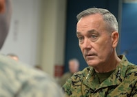 U.S. Marine Corps Gen. Joseph F. Dunford Jr., chairman of the Joint Chiefs of Staff, speaks with an Airman at Minot Air Force Base, N.D., Nov. 2, 2016. Dunford toured various 5th Bomb Wing and the 91st MW’s facilities to learn about their mission and capabilities. (U.S. Air Force photos/Airman 1st Class Jessica Weissman)