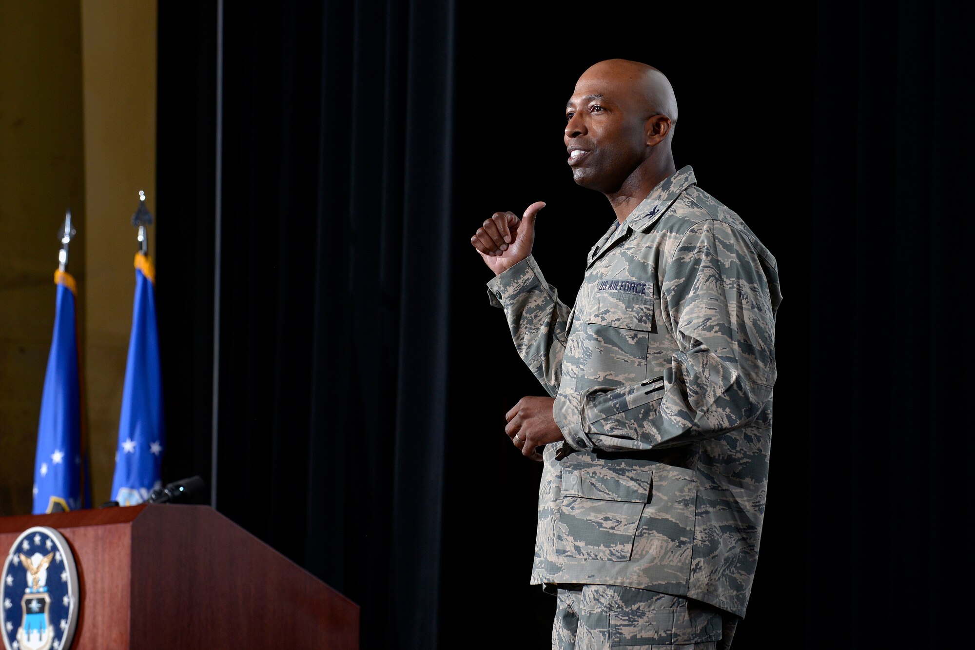 Col. Troy Dunn. commander of the 10th Air Base Wing at the U.S. Air Force Academy, speaks from the stage in Arnold Hall Nov. 4, 2016. Dunn hosted an all call to to discuss his priorities as commander, thank his team of Total Force Airmen, and advocate for the care and concern of Airmen at the wing. (U.S. Air Force photo/Jason Gutierrez)