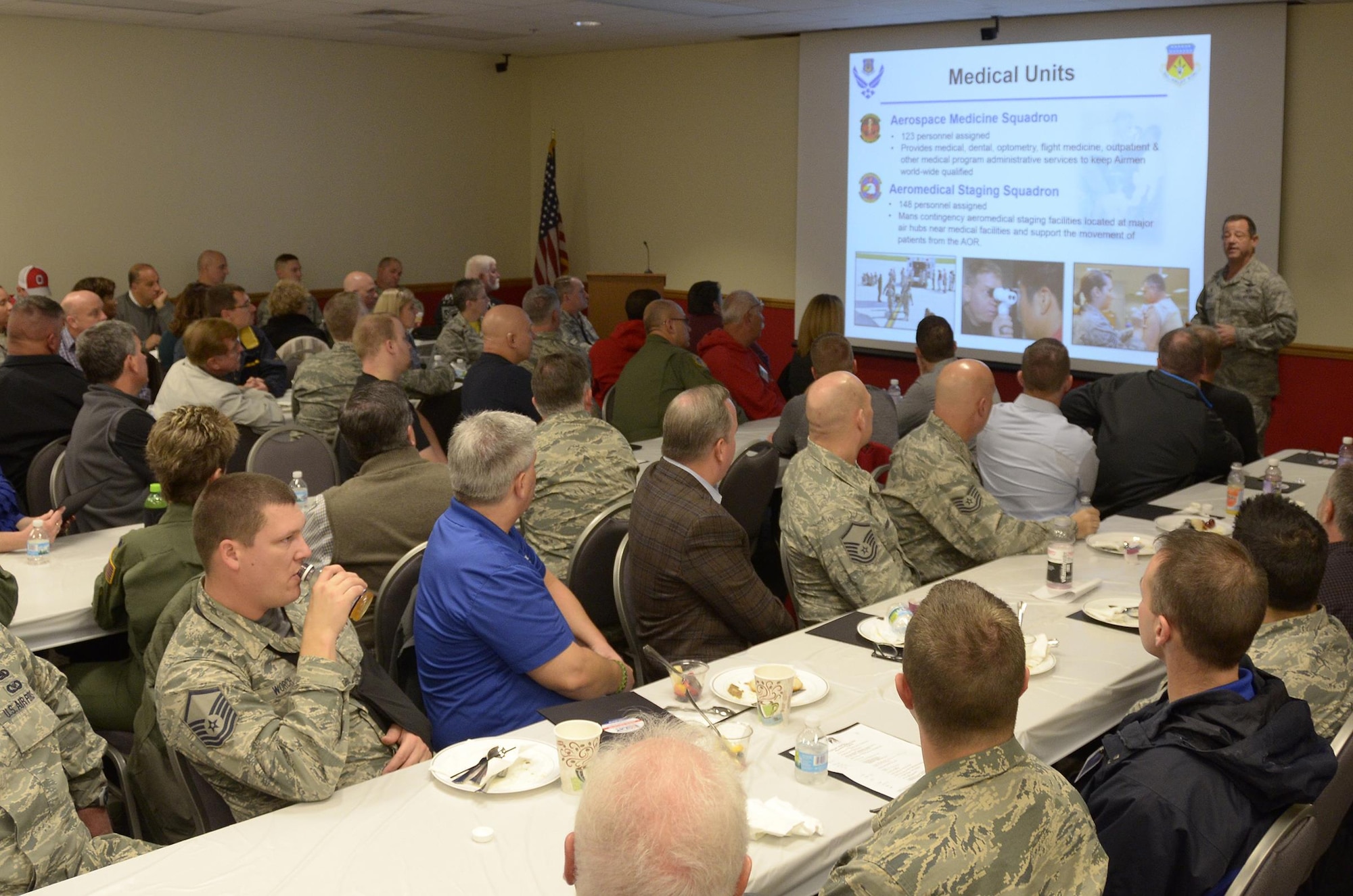 Col. Adam Willis, 445th Airlift Wing commander, gives a wing mission briefing to approximately 70 civilian employers and 35 reservists during the 445 AW Employers Day Nov. 5, 2016. The employers enjoyed breakfast and lunch, received a C-17 Globemaster III flight, participated in tours and demonstrations of the different jobs and training that their Air Force Reserve employees do when performing military service. The employers also received information about the Employer Support of the Guard and Reserve program. (U.S. Air Force photo/Staff Sgt. Joel McCullough)