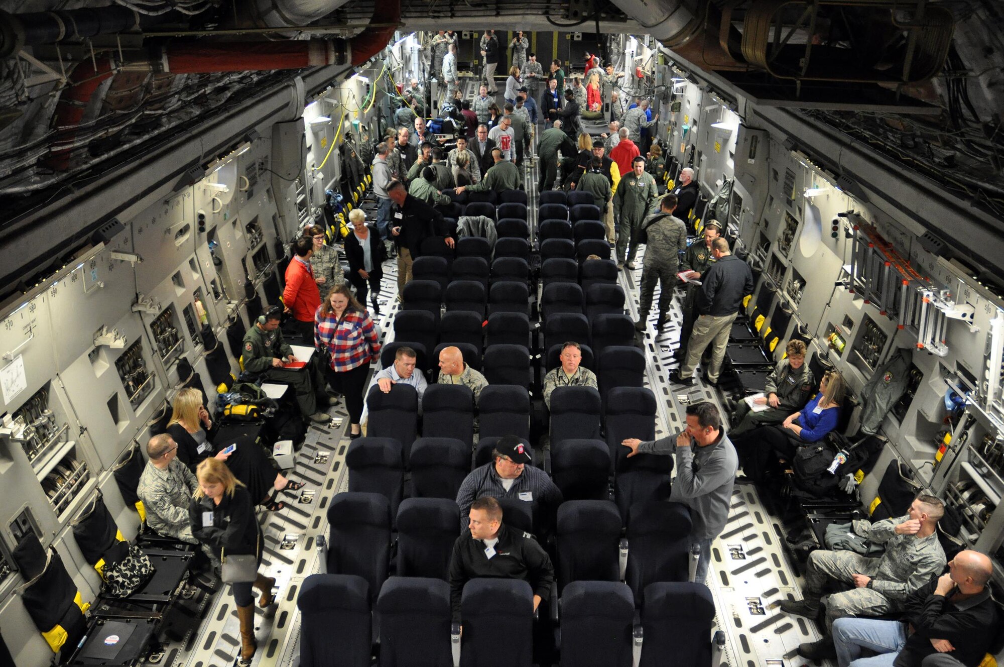Employers participating in the 445th Airlift Wing Employers Day Nov. 5, 2016 fly in a C-17 Globemaster III while the 445th Aeromedical Evacuation Squadron perform a demonstration on board. Approximately 70 employers and 35 reservists enjoyed breakfast and lunch, received a flight, participated in tours and demonstrations of the different jobs and training that their Air Force Reserve employees do when performing military service. The employers also received information about the Employer Support of the Guard and Reserve program. (U.S. Air Force photo/Staff Sgt. Rachel Ingram)