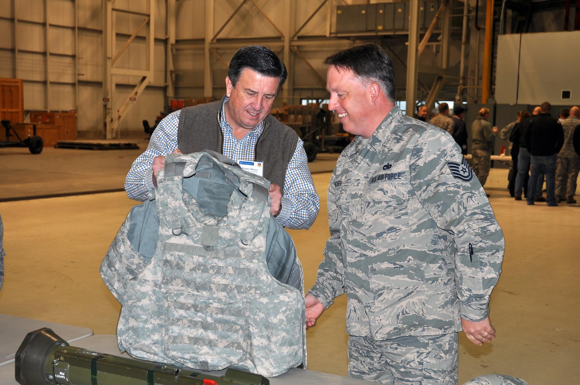 Tech. Sgt. Jeffrey Fischer, 87th Aerial Port Squadron passenger services flight craftsman, and his employer, Ronny Hayes, territory manager/vice president Hearing Lab Technology, check out a flack vest as part of the 445th Security Forces Squadron demonstration during the 445th Airlift Wing Employers Day Nov. 5, 2016. Approximately 70 employers and 35 reservists enjoyed breakfast and lunch, received a C-17 Globemaster III flight, participated in tours and demonstrations of the different jobs and training that their Air Force Reserve employees do when performing military service. The employers also received information about the Employer Support of the Guard and Reserve program. (U.S. Air Force photo/Staff Sgt. Rachel Ingram)