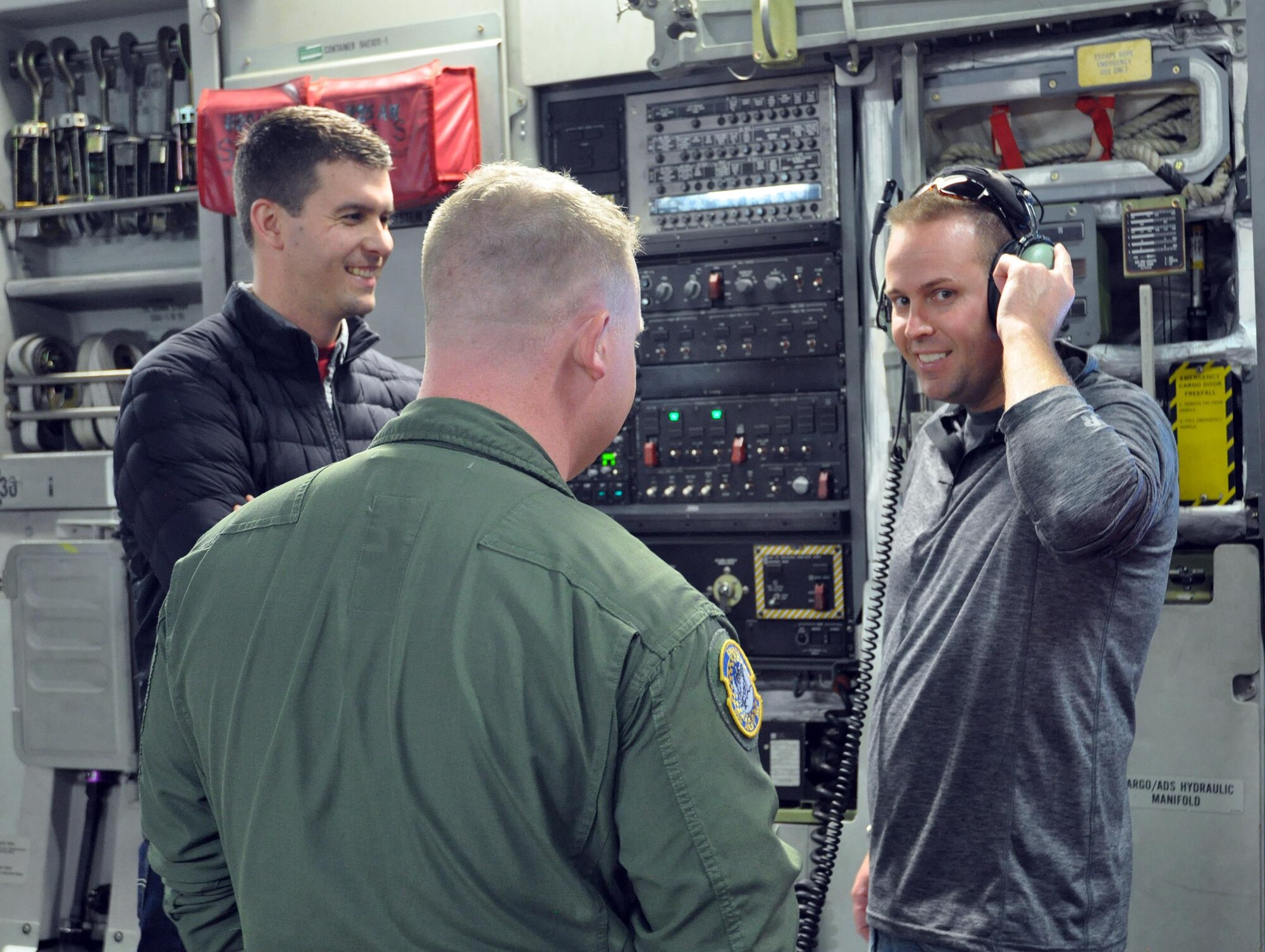 Staff Sgt. Zachary Webb, 89th Airlift Squadron C-17 loadmaster, shows employers participating in the 445th Airlift Wing Employers Day some of the duties he performs during a flight Nov. 5, 2016. During the day, approximately 70 employers and 35 reservists enjoyed breakfast and lunch, received a C-17 Globemaster III flight, participated in tours and demonstrations of the different jobs and training that their Air Force Reserve employees do when performing military service. The employers also received information about the Employer Support of the Guard and Reserve program. (U.S. Air Force photo/Staff Sgt. Rachel Ingram)