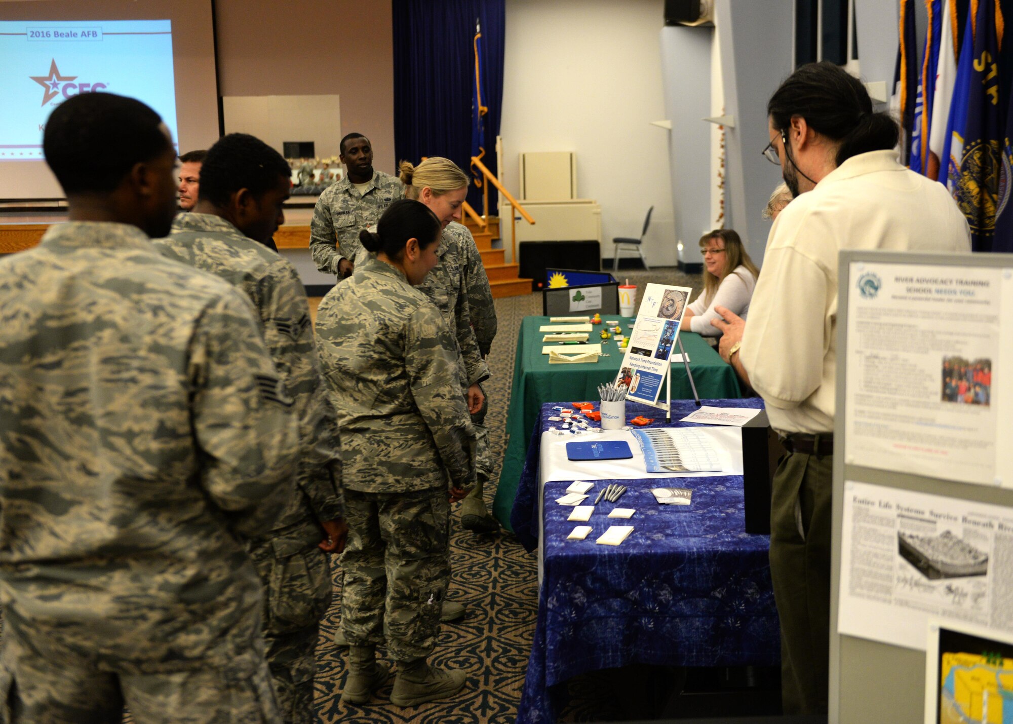 Airmen speak to representatives of local charity organizations at the Combined Federal Campaign kickoff event Nov. 7, 2016, at Beale Air Force Base, California. Since the first campaign in 1964, Federal employees have donated more than $8 billion for the charities and causes that are near and dear to them. (U.S. Air Force photo/Staff Sgt. Jeffrey Schultze)