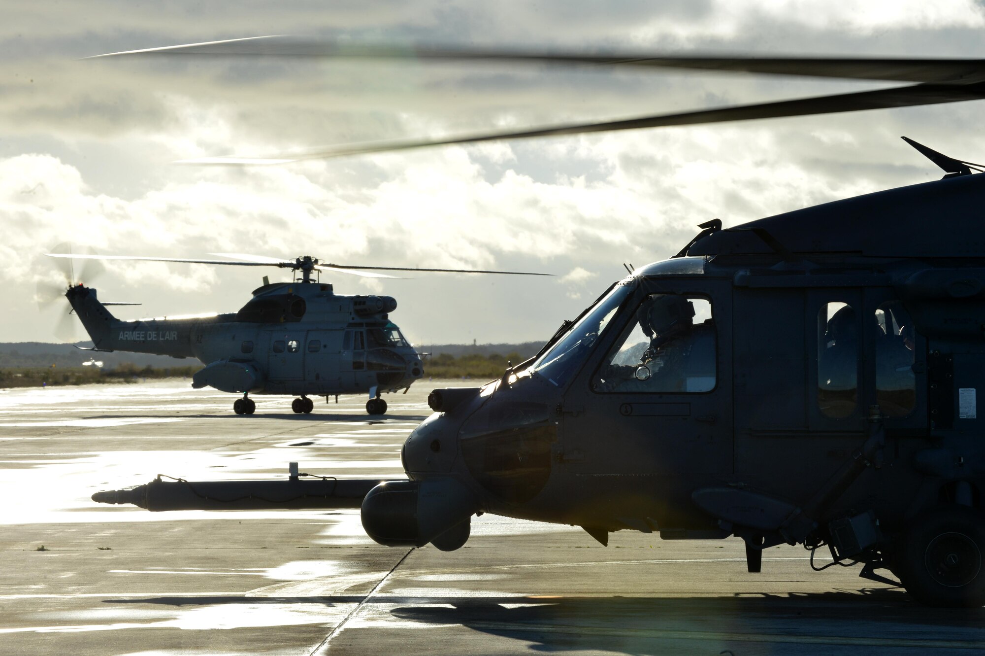 A U.S. Air Force HH-60G Pave Hawk assigned to the 56th Rescue Squadron at Royal Air Force Lakenheath, England, prepares to take off Nov. 7 during Exercise Salamander at Cazaux Air Force Base, France, as a French Air Force SA-330 Puma taxis past. The exercise in an opportunity for U.S. Air Force HH-60G aircrew, Guardian Angel teams and maintenance Airmen to hone their skills in a dynamic environment and prepare for future combat operations. (U.S. Air Force photo/Master Sgt. Eric Burks)