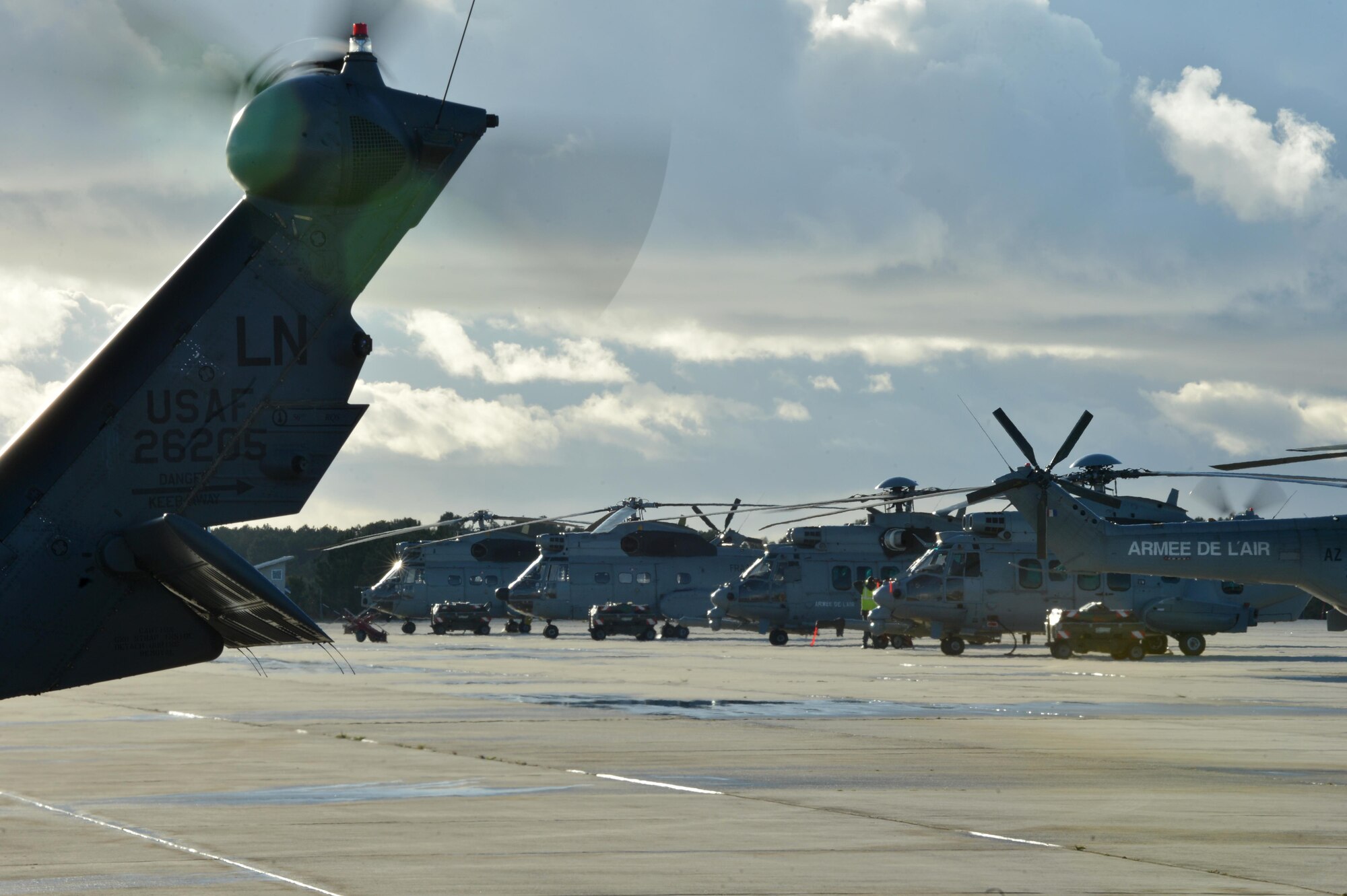 A U.S. Air Force HH-60G Pave Hawk assigned to the 56th Rescue Squadron at Royal Air Force Lakenheath, England, prepares to take off Nov. 7 during Exercise Salamander at Cazaux Air Force Base, France, as French Air Force EC-725 Caracals and SA-330 Pumas sit on the taxiway. Two HH-60G Pave Hawk helicopters assigned to the 56th RQS and approximately 100 Airmen are involved in the joint training exercise with French air force members and helicopters. (U.S. Air Force photo/Master Sgt. Eric Burks)