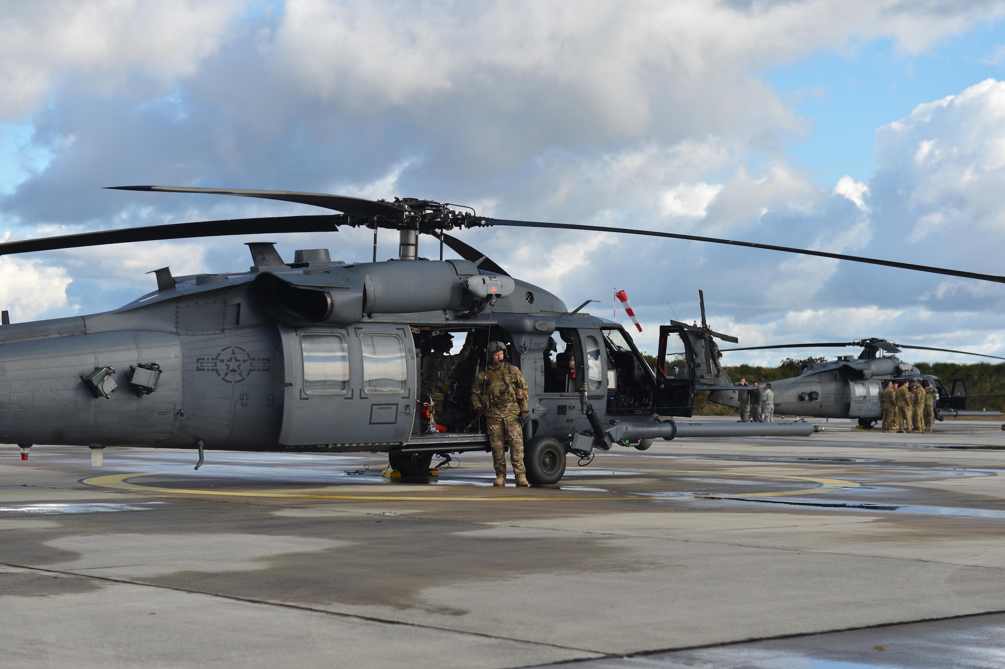56th and 57th Rescue Squadron Airmen perform pre-flight checks on HH-60G Pave Hawks prior to a flying mission Nov. 7 during Exercise Salamander at Cazaux Air Force Base, France. Two HH-60G Pave Hawk helicopters assigned to the 56th RQS and approximately 100 Airmen are involved in the joint training exercise with French Air Force members and helicopters. (U.S. Air Force photo/Master Sgt. Eric Burks)