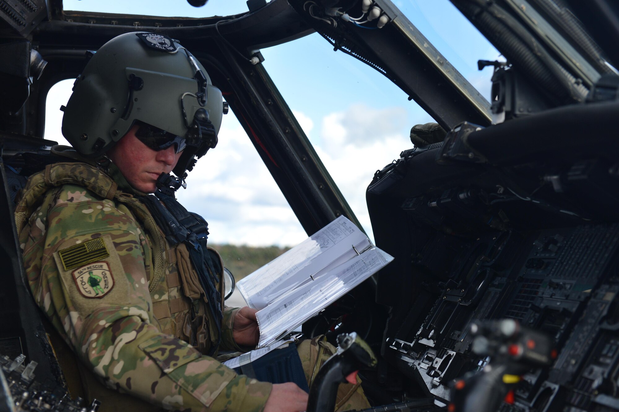 An instructor pilot assigned to the 56th Rescue Squadron prepares mission systems Nov. 7 during Exercise Salamander at Cazaux Air Force Base, France. The exercise is an opportunity for U.S. Air Force HH-60G aircrew, Guardian Angel teams and maintenance Airmen to hone their skills in a dynamic environment and prepare for future combat operations. (U.S. Air Force photo/Master Sgt. Eric Burks)