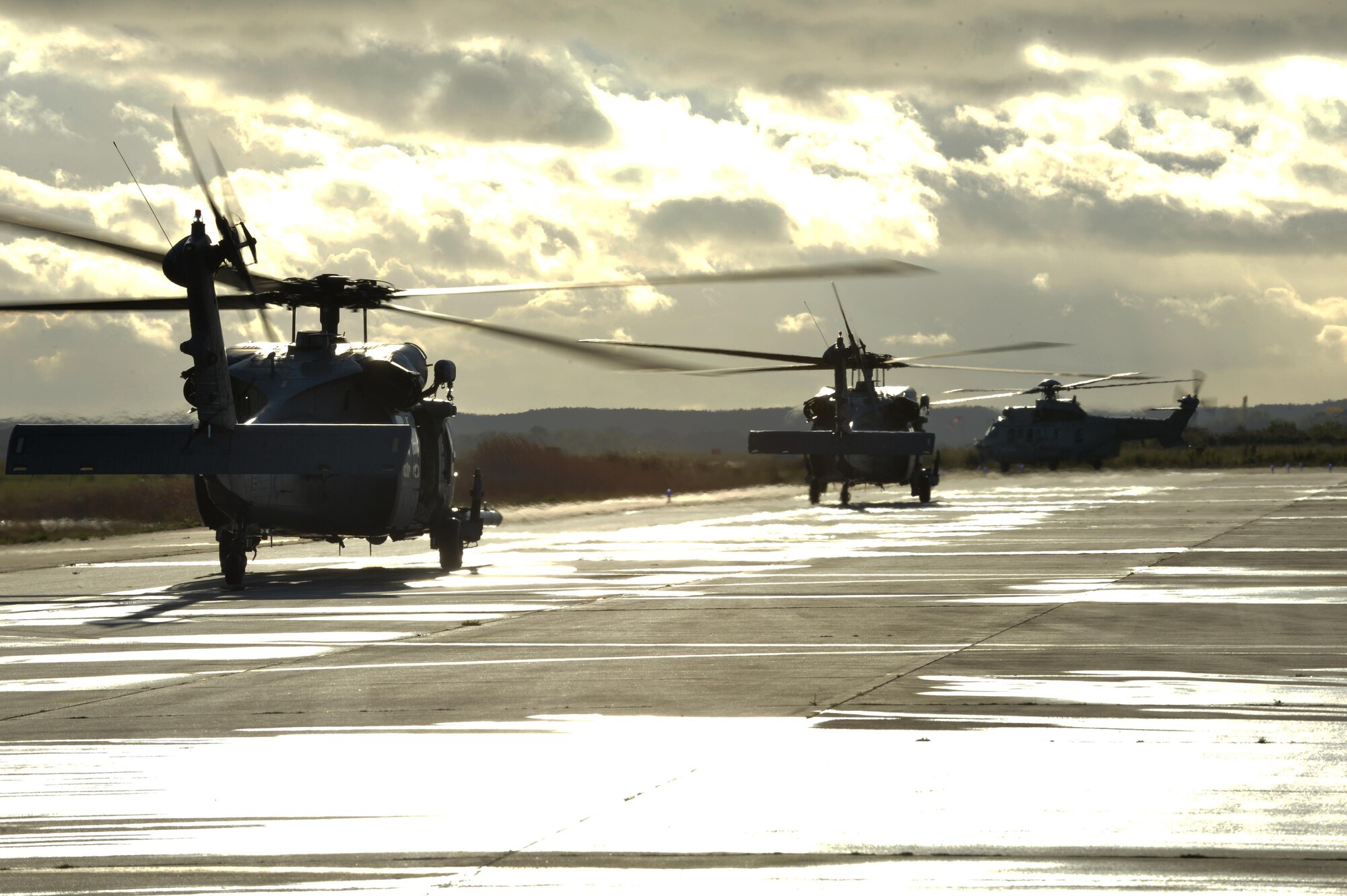 Two U.S. Air Force HH-60G Pave Hawks assigned to the 56th Rescue Squadron at Royal Air Force Lakenheath, England, prepare to take off with a French air force EC-725 Caracal assigned to the 1/67 Pyrénées Squadron, Nov. 7 during Exercise Salamander at Cazaux Air Force Base, France. Participation in joint exercises allows U.S. forces to bolster relationships and interoperability with international partners. (U.S. Air Force photo/Master Sgt. Eric Burks)