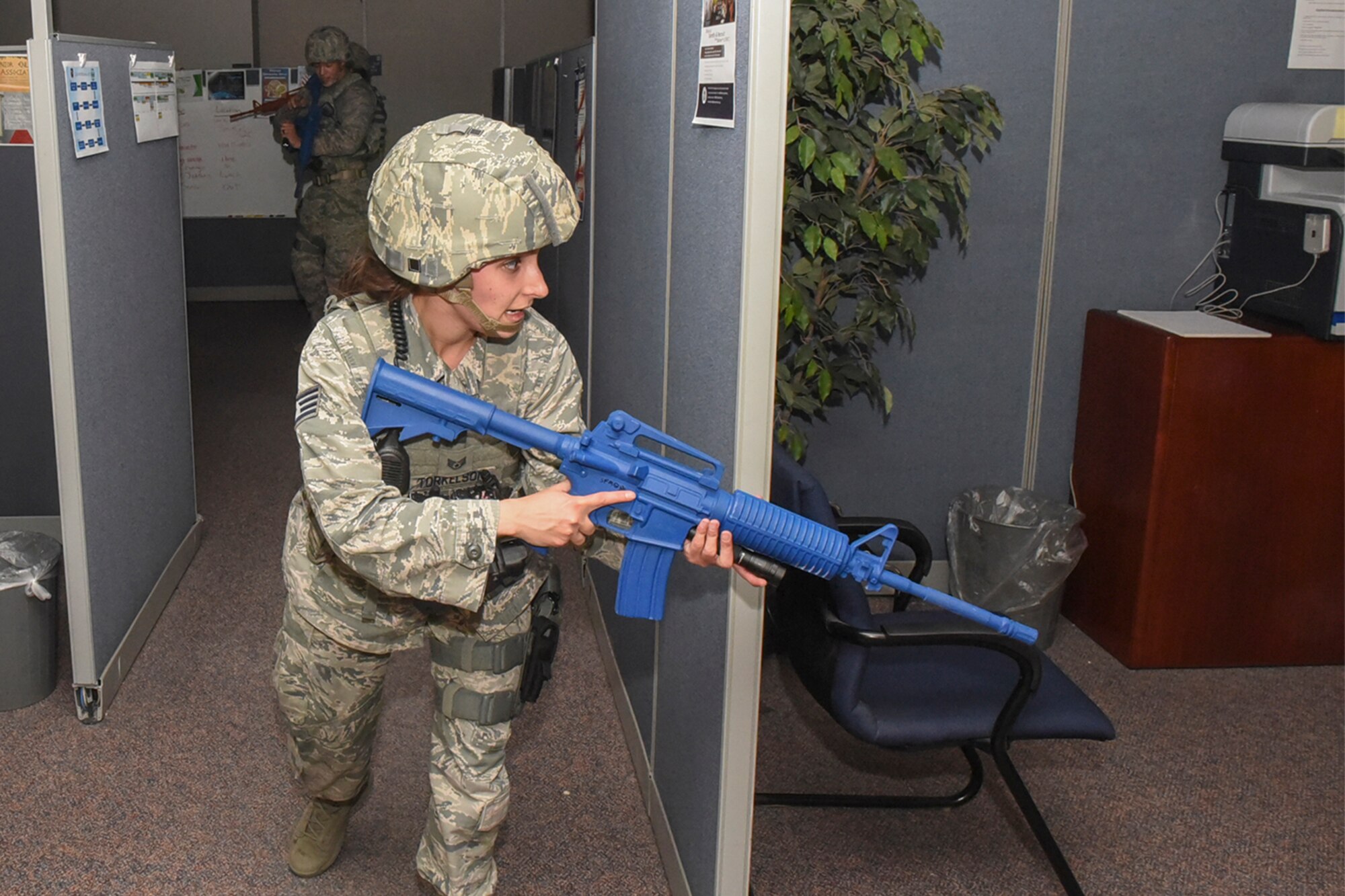 PETERSON AIR FORCE BASE, Colo. –Staff Sgt. Torkelson, 21st Security Force Squadron defense operations center controller, and Staff Sgt. Adam Whitney, 21st SFS patrolman, conduct a sweep of building 350 during an active-shooter scenario at Peterson Air Force Base, Colo., Nov. 1, 2016. This was just one scenario which was played out during Condor Crest, a wing-wide exercise. (U.S. Air Force photo by Philip Carter)