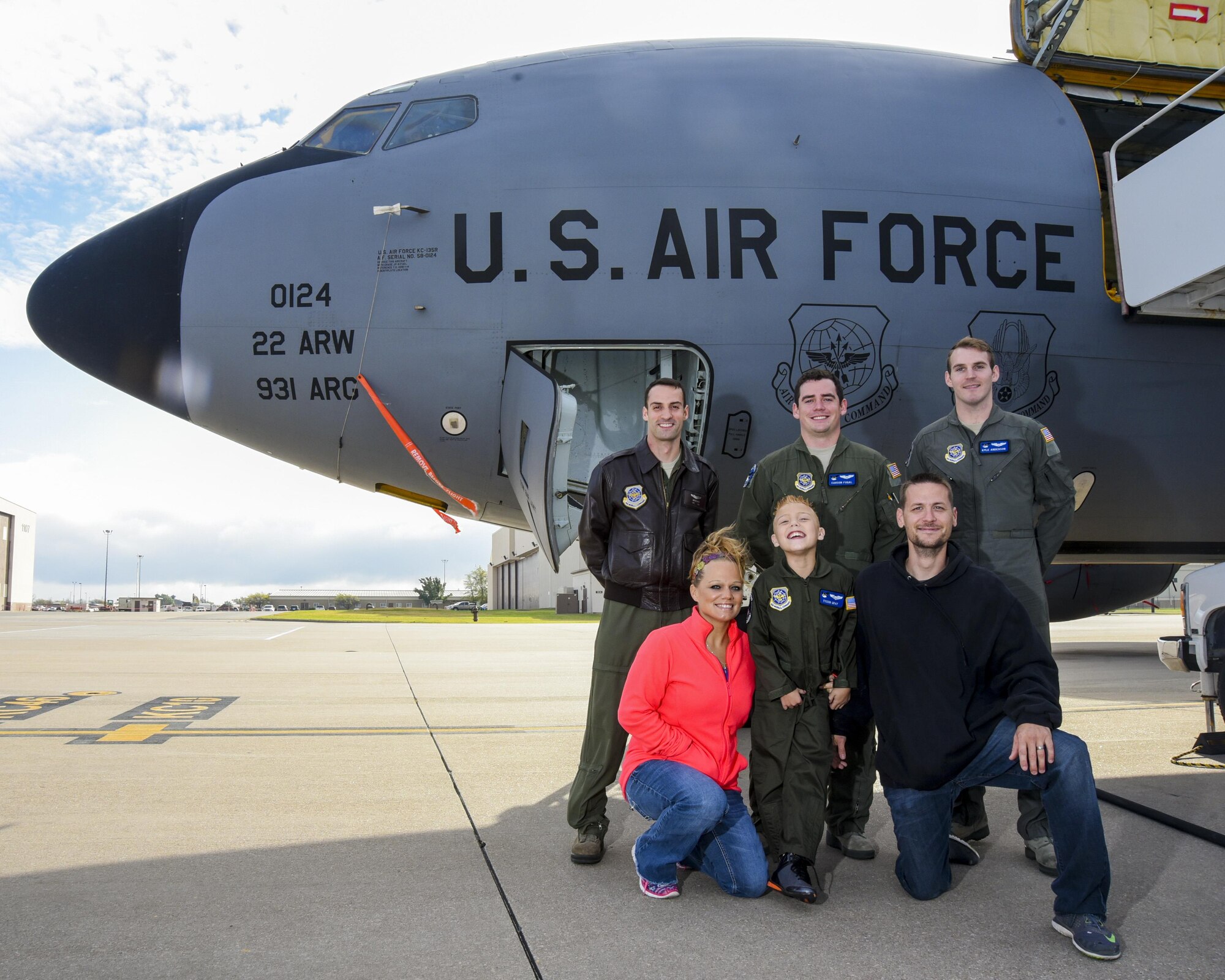 Tyson Gray, 10 years old, poses for a photo with his parents and air crew members of Team McConnell Nov. 8, 2016, at McConnell Air Force Base, Kan. Tyson battles mild cerebral palsy and became the latest honorary member of the 344th Air Refuleing Squadron as part of the squadron’s “Pilot for a Day” program. (U.S. Air Force photo/Senior Airman Christopher Thornbury)