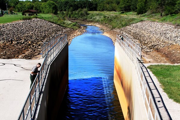 Every Kansas City District Project Office has a dam surveillance plan and emergency action plan specific for that lake's location. Following the Sept. 3, 2016, 5.6 magnitude earthquake in Pawnee, Okla., lake office personnel conducted initial inspections of the dam for abnormalities, shifts or cracks. Here Smithville Lake Park Ranger Derek Dorsey inspects the dam for damage rom the earthquake.