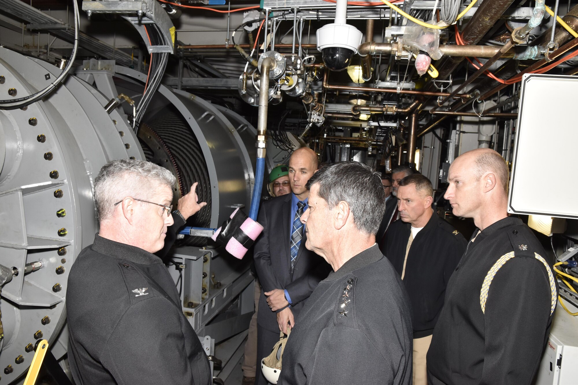 Vice Chief of Naval Operations Adm. Bill Moran gets a detailed walk-through at the Advanced Arresting Gear Runway Arrested Landing Site at Naval Air Systems Command during a visit to Joint Base McGuire-Dix-Lakehurst, New Jersey, Nov. 7.