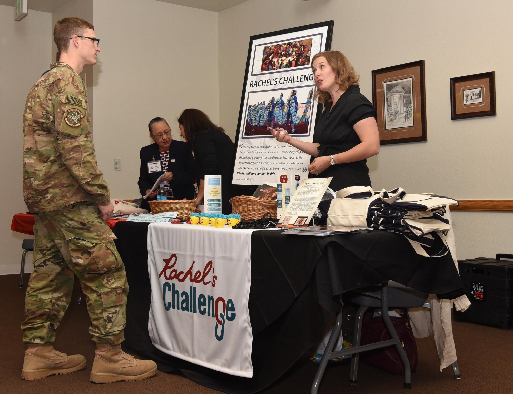 A local Cheyenne charity representative explains what her cause is about at F.E. Warren Air Force Base, Wyo., Nov. 7, 2016. Charities in the local communtiy set up booths at the kick-off event to help educate donors. (U.S. Air Force photo by Airman 1st Class Breanna Carter)