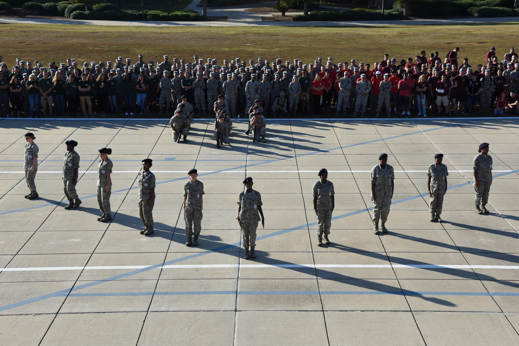 Members of the Biloxi High School JROTC drill team provide a guest performance during the 81st Training Group drill down at the Levitow Training Support Facility drill pad Nov. 4, 2016, on Keesler Air Force Base, Miss. The quarterly drill down featured an open ranks inspection, regulation drill routine and freestyle drill routine categories. The 81st TRG’s four non-prior service training squadrons competed in the competition, with the 334th TRS “Gators” taking home the overall first place. (U.S. Air Force photo by Kemberly Groue/Released)
