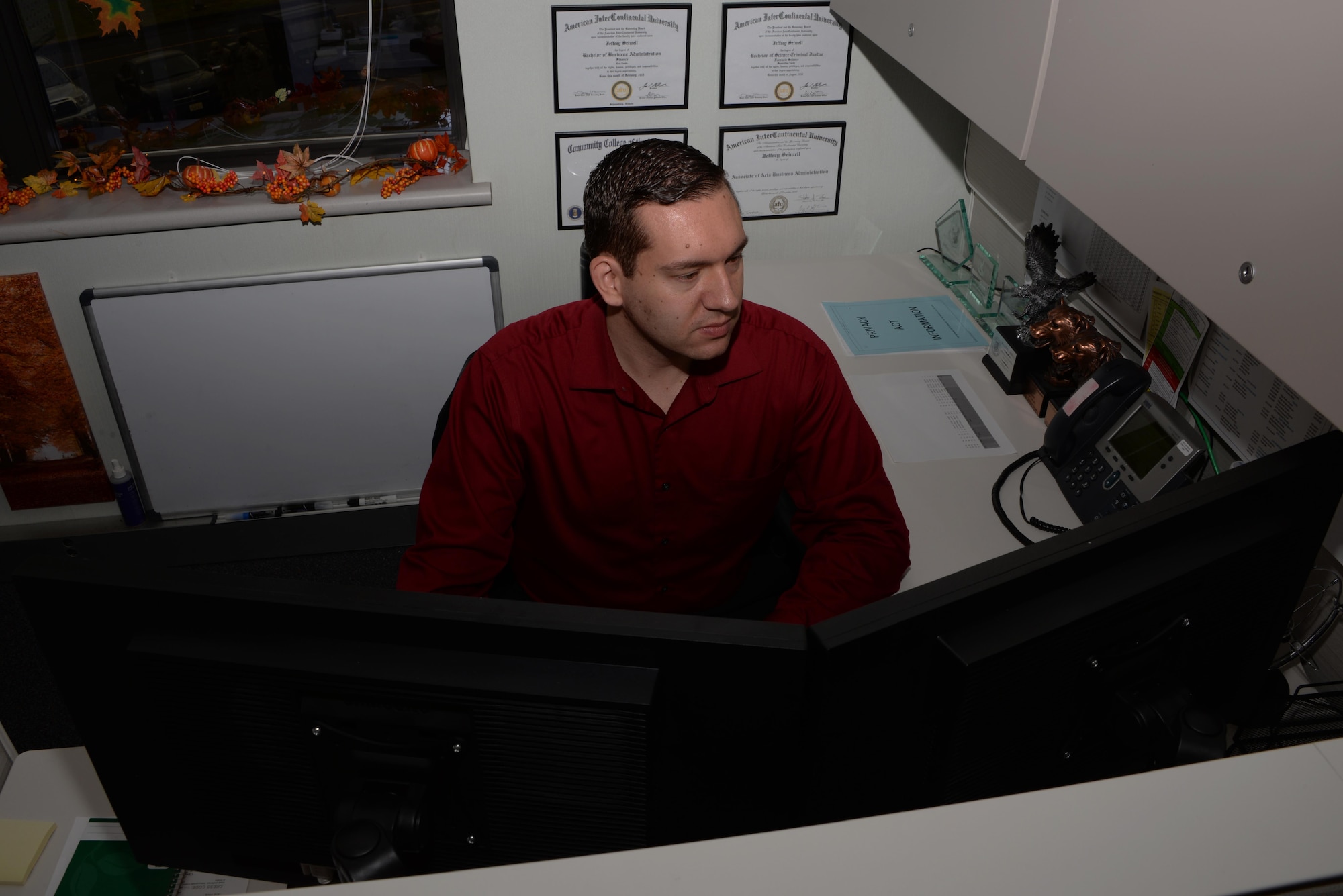 Jeffrey Seiwell, 60th Comptroller Squadron budget analyst and Air Force veteran, works at his desk at Travis Air Force Base, Calif., Oct. 25, 2016. Seiwell was honorably discharged from the Air Force in October 2013 and now works as a federal civilian employee. (U.S. Air Force photo/Tech. Sgt. James Hodgman)