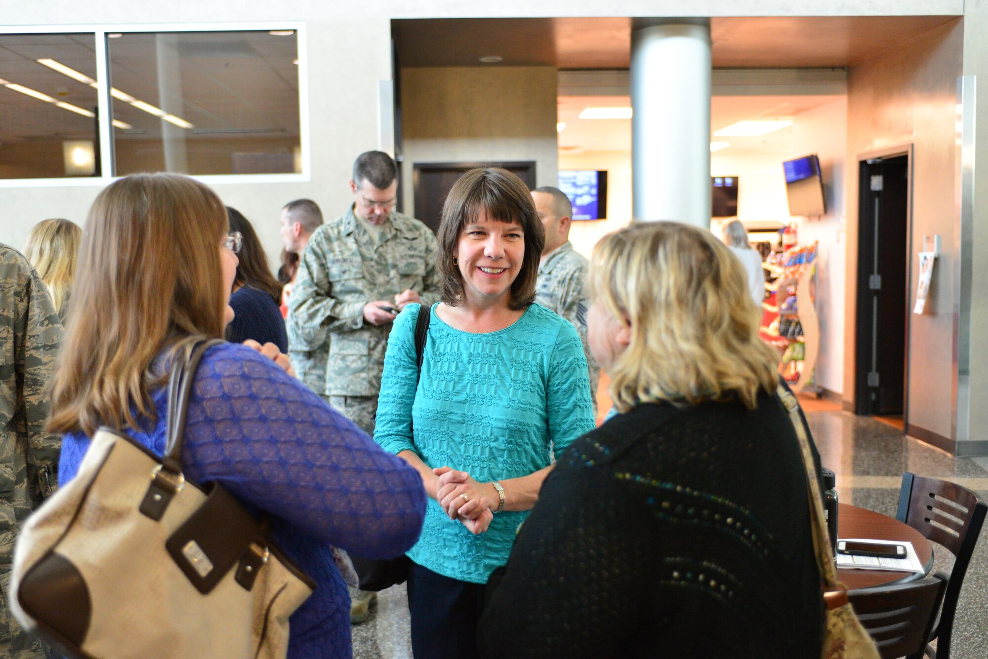 Leanne Norvell, spouse of Maj. Michael Norvell, director of operations with the 2nd Weather Group, Detachment 1, speaks to other spouses in the 557th Weather Wing at Offutt Air Force Base, Neb., during the Spouses Town Hall Nov. 1, 2016. The town hall, which included briefings on the Key Spouses program, a meet and greet with wing leadership and a tour of the 557th WW facilities, gave spouses a greater understanding of the 557th WW mission. (U.S. Air Force photo/Senior Airman Rachel Hammes)