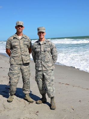 As the program manager for the 920th Rescue Wing's Developmental and Training Flight, Master Sgt. Robert Carcieri (left) mentors new enlistees like Senior Airman Brandon Kalloo Sanes (right) prior to attending Basic Military Training. Sanes attributed graduating with honors from BMT to his experience serving in Carcieri's DT&F. (U.S. Air Force photo/Capt. Leslie Forshaw)