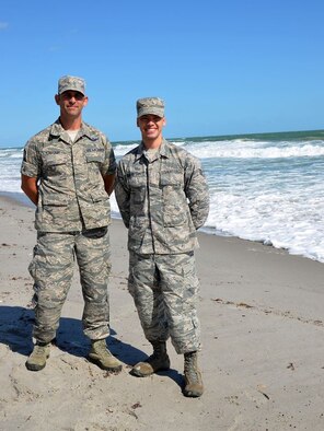 As the program manager for the 920th Rescue Wing's Developmental and Training Flight, Master Sgt. Robert Carcieri (left) mentors new enlistees like Senior Airman Brandon Kalloo Sanes (right) prior to attending Basic Military Training. Sanes attributed graduating with honors from BMT to his experience serving in Carcieri's DT&F. (U.S. Air Force photo/Capt. Leslie Forshaw)